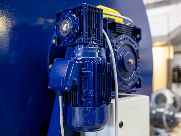 Electric motor and gear mounted on a blue steel winch