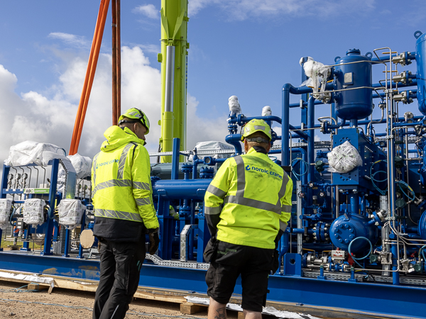 Crane personnel discussing the project