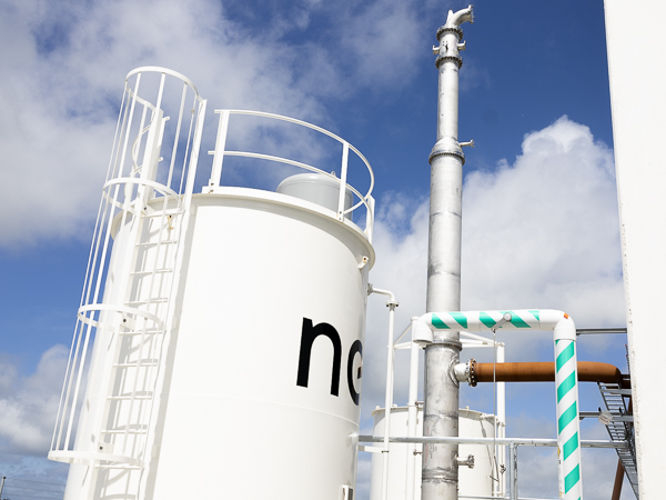 Nel power-to-x scrubber tank with blue skies in the background.