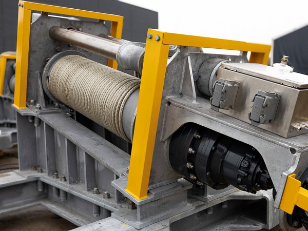 Winch with Dynema rope mounted on galvanised steel structure.