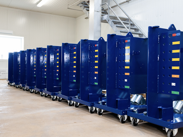 Row of Turner Gear units with blue cabinets and color-coded labels on a factory floor.