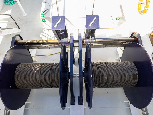 An overhead view of a double-drum split winch installed on a vessel.