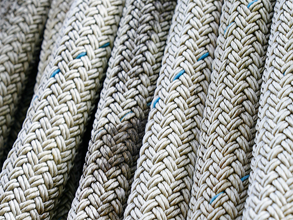 Close-up of durable braided synthetic rope used in marine and fishing winches for heavy-duty applications.