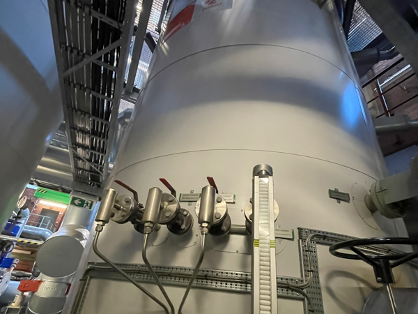 Detail view of an industrial electrode boiler with valves and level indicator during service work at N-ERGIE Kraftwerke in Nuremberg.