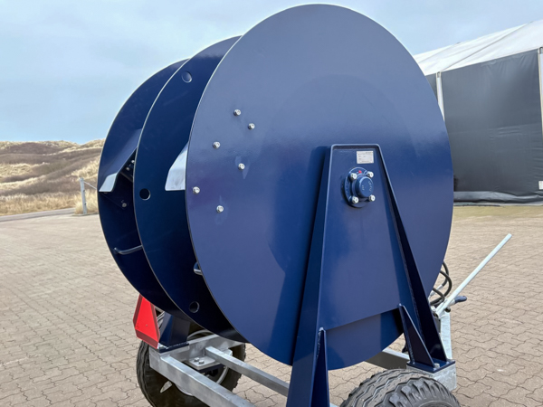 Blue heavy-duty cable reel trailer with robust drum construction designed for 2 × 60 metres Ø52 cable.