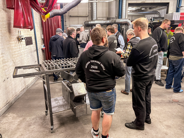 Visitors gathered around Martin’s barbecue trolley at the final apprenticeship project exhibition at Skjern Technical College.
